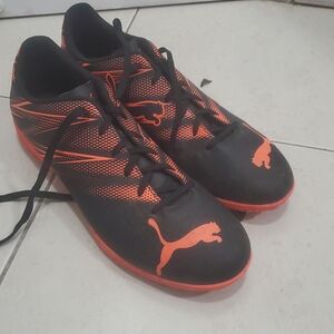 Puma Black and Orange Athletic Cleats